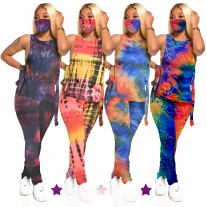 Detailed view of the 3-piece tie-dye set including halter crop top, pants, and matching mask