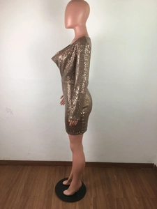 Detail of shimmering bronze sequins on a long-sleeve sexy party dress for women