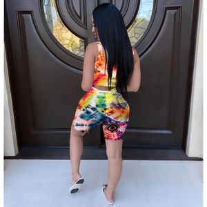 Back view of a vibrant colorful tie-dye two-piece women set showing slim fit crop top and shorts