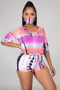 Detailed look at the pink tie-dye three-piece set including V-neck top, shorts and face mask