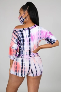 Detail of tie-dye fabric on women's casual set with off-shoulder top and shorts