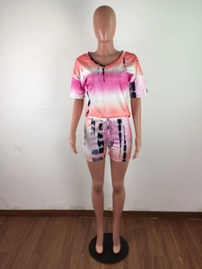 Detail of V-neck tie-dye short sleeve top and drawstring shorts on a mannequin