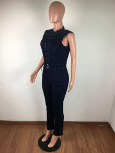 Detail of dark blue denim jumpsuit with lace-up front metal eyelets and side pockets