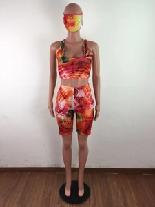 Three-piece women's tie-dye lounge set featuring a crop top, biker shorts, and face mask