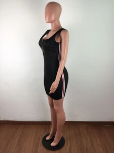 Detail of slim fit black dress featuring side red and white stripes and metal ring zipper