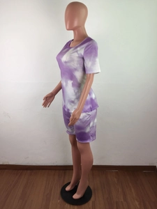 Detailed side view of tie-dye lounge set featuring purple round neck tee and matching shorts