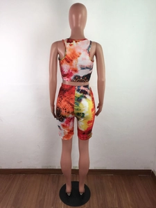 Rear view of tie-dye sports set featuring a racerback crop top and high-stretch shorts
