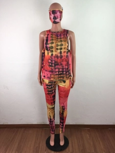 Detailed view of three-piece tie-dye set featuring crop top, leggings, and matching mask