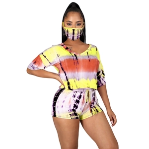 Detail of colorful tie-dye three-piece set featuring V-neck top and drawstring shorts