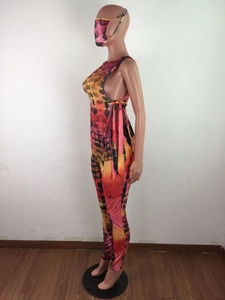 Detailed view of women's tie-dye set showing the matching mask and side-tie vest detail
