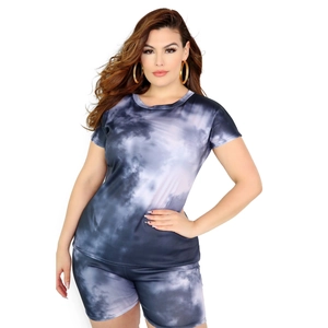 Detail view of plus size tie-dye two-piece set featuring round neck tee and biker shorts