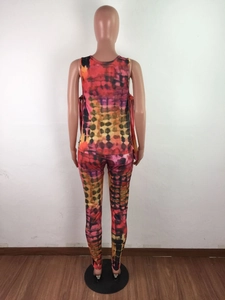 Rear view of women tie-dye loungewear set with orange and purple geometric spot patterns