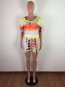 Detail view of colorful tie-dye casual two-piece set featuring a V-neck top and drawstring shorts