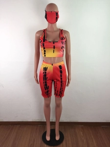 Three-piece women's set featuring tie-dye top, cycling shorts and matching mask