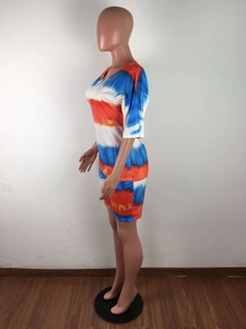 Detail of summer tie-dye loungewear set featuring vibrant orange and blue stripes
