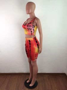 Detail of women's tie-dye athletic set featuring gradient colors and elastic fabric texture