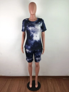 Detail of blue and white tie-dye two-piece set showing round neck top and shorts on mannequin