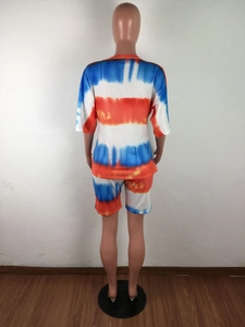 Rear view of women's tie-dye lounge set featuring a crewneck top and elastic shorts
