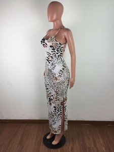 Detail of slim fit leopard print maxi dress with backless cut and side slit