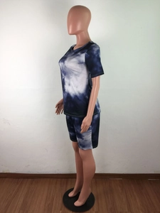 Detail view of women's tie-dye lounge set with crewneck t-shirt and athletic shorts