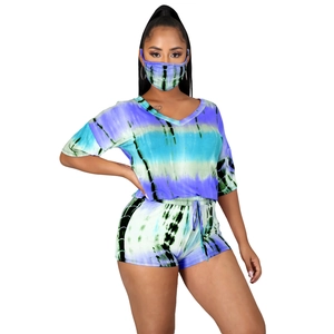 Detailed view of women's blue tie-dye set including V-neck t-shirt and drawstring shorts