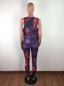 Detail of purple tie-dye two-piece loungewear set with side drawstring vest and leggings