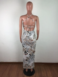 Detail of cross back tie-up design on leopard print backless maxi dress for women