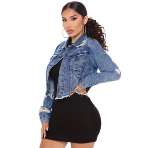 Cropped denim jacket with distressed fringe and ripped details on a white background