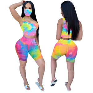 Detailed front and back view of vibrant tie-dye crop top, shorts, and matching mask set