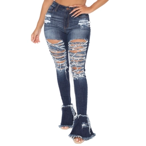 Women's vintage washed bell-bottom jeans with distressed ripped details and frayed hem