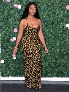 Detail of leopard print maxi dress featuring high side slit and backless bandage design