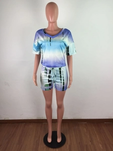Detail view of tie-dye lounge set with V-neck top and drawstring shorts for women