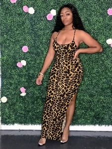 Detail of leopard print bodycon maxi dress with thin straps and a high side slit design