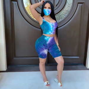 Detailed view of women tie-dye three-piece set featuring crop top, biker shorts and matching mask