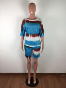 Detail of two-piece tie-dye set showing blue and brown marble print on knit fabric