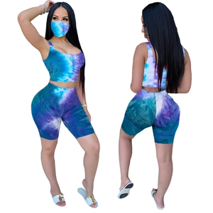 Three-piece women's tie-dye lounge set with cropped tank top, biker shorts and face mask