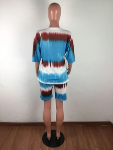 Rear view of women's tie-dye lounge set with crewneck top and matching shorts