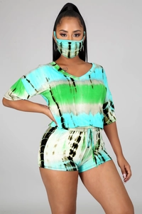 Detail of three-piece tie-dye summer set with V-neck top, shorts and matching mask