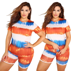 Close-up of vibrant orange and blue tie-dye texture on stretchy knitted short set