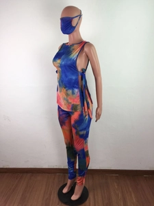Detail of three-piece tie-dye set featuring lace-up tank top, leggings, and matching mask