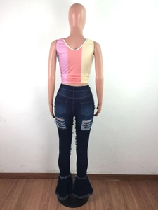 Rear view of high waist flare jeans with distressed details and frayed bell bottoms