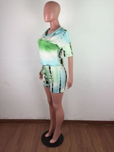 Detailed side view of tie-dye lounge set featuring green and blue gradient fabric texture