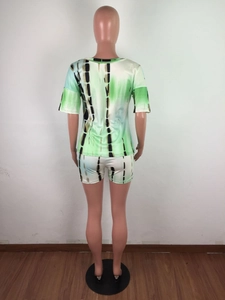 Rear view of women's two-piece set with green tie-dye print and vertical stripes