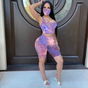 Detailed view of women's purple tie-dye set including crop top, shorts, and matching face mask