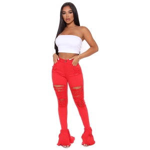 Women's streetwear set with white tube top and red distressed flared fringe jeans