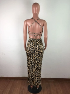 Detail view of the backless leopard print maxi dress with cross strap lacing detail