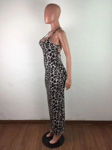Detailed view of the leopard print maxi dress with cross-back tie straps and backless design