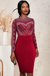 Close-up of red bodycon dress featuring sheer mesh sleeves and glittering rhinestone patterns