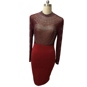 Detailed view of burgundy long sleeve party dress with silver rhinestones on mesh top