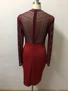 Rear view of long sleeve party dress with sequins and back zipper detail